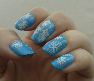 Dark blue and white Christmas snowflake airbrushed nail design